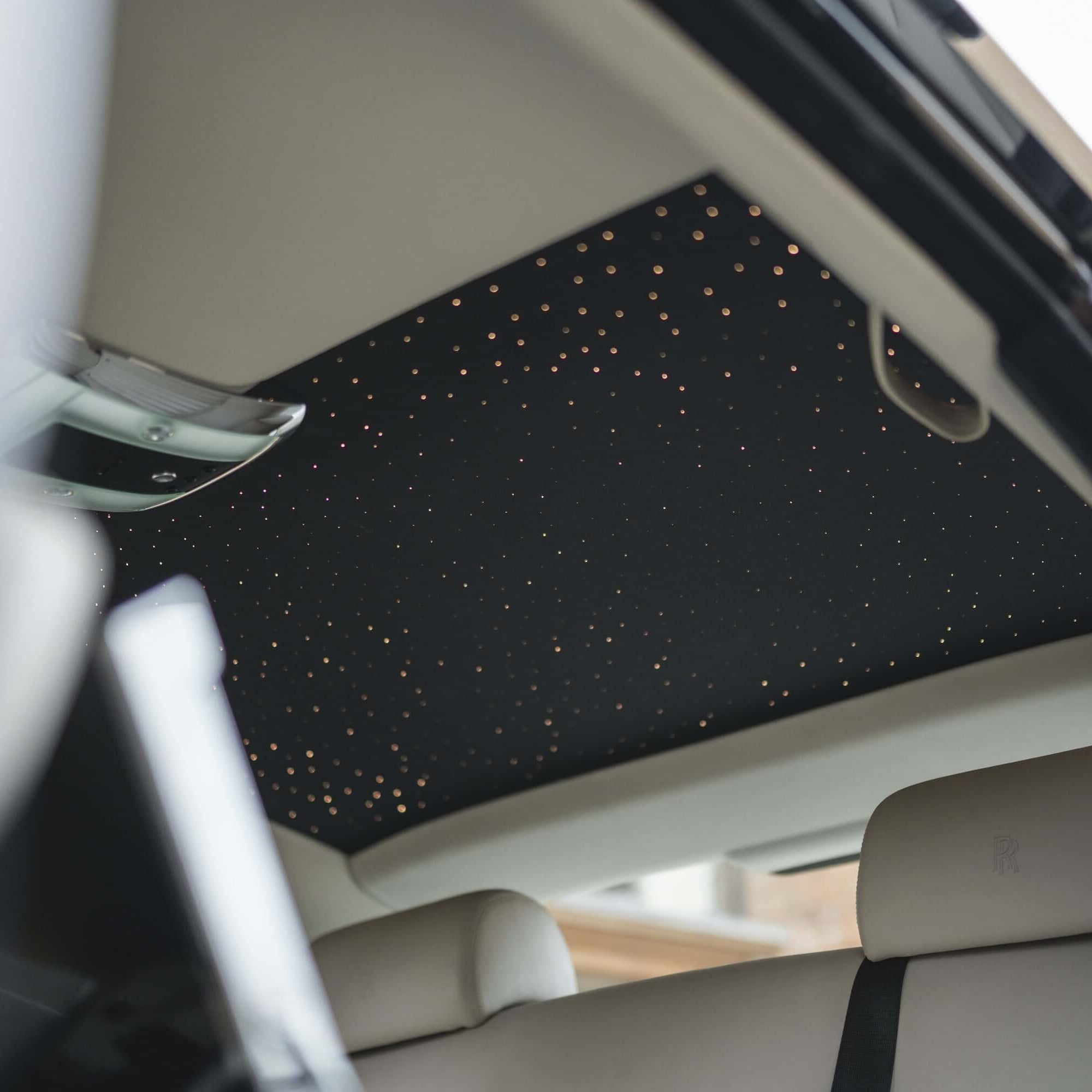 Experience luxury travel with SJ Chauffeurs: detailed view of our Rolls Royce starlight ceiling